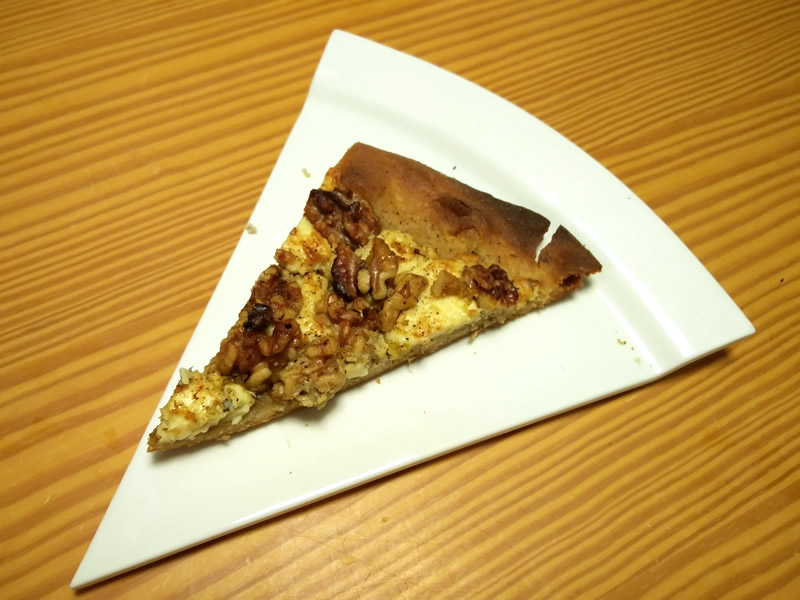 Picture of a slice of Gorgonzola and walnut pizza