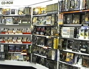 A screencapture from a video showing the CD-ROM shelves at Babbage's. Although it's difficult to make out individual titles, the shelves are tightly packed.