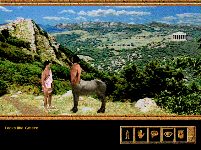 Screenshot from Wrath of the Gods. The hero and Chiron the Centaur stand on a mountain overlooking the Greek countryside. "Looks like Greece."