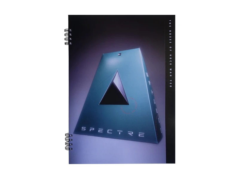 The cover of the book The Boxes of Hock Wah Yeo, showing the teal, pyramid-shaped boxed for <em>Spectre</em>.